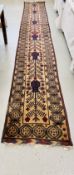 AN ELABORATE VINTAGE BELOUCH RUNNER 575CM X 77CM.