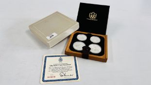 A CASED SET OF SILVER OLYMPIC COIN PROOF SET WITH CERTIFICATE OF AUTHENTICITY CERTIFIED U064058.