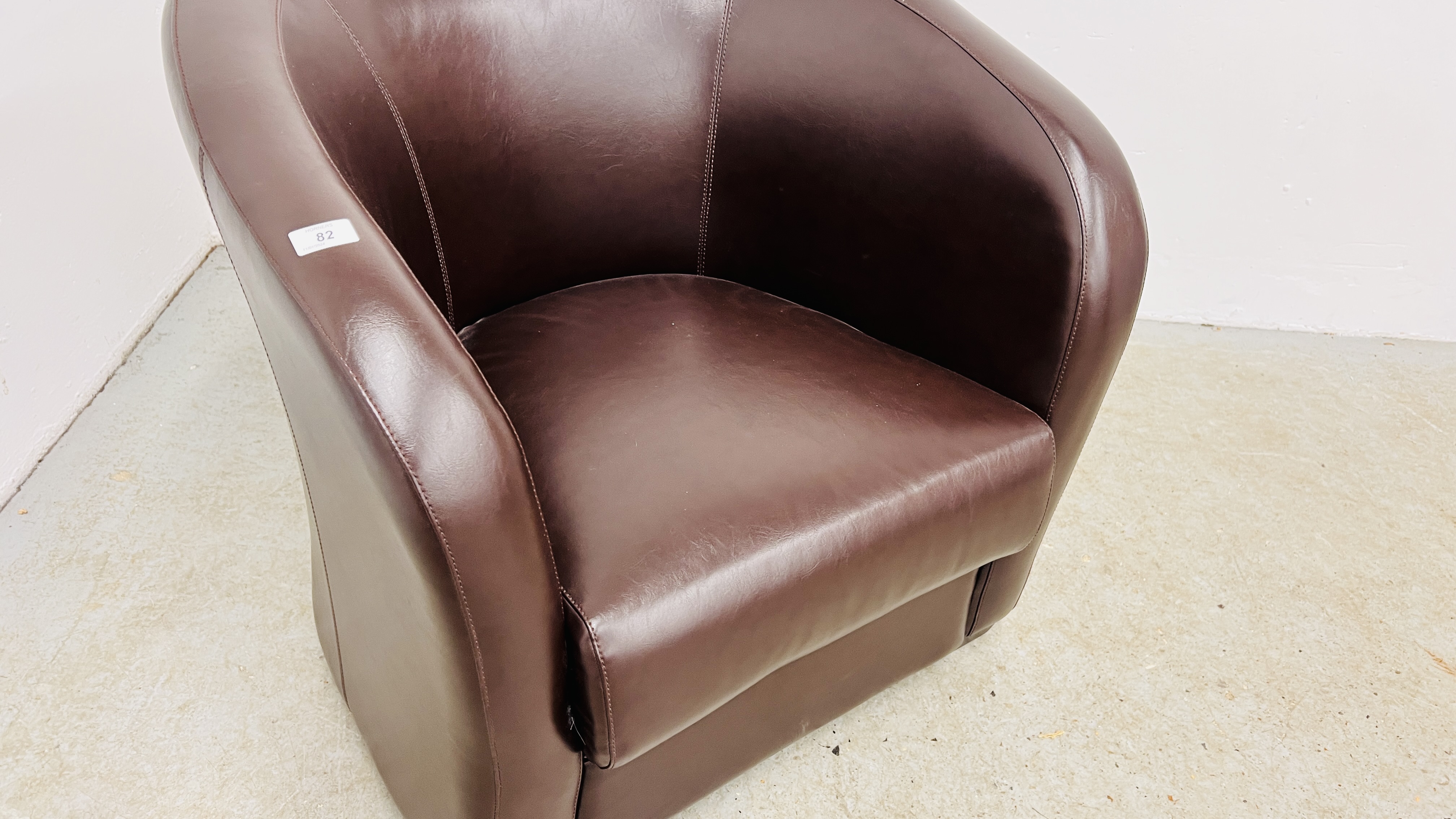 A MODERN BROWN FAUX LEATHER TUB CHAIR. - Image 3 of 5