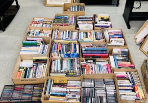 20 BOXES OF MIXED GENRE BOOKS,CD'S AND DVD'S.