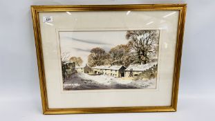 A FRAMED AND MOUNTED WATERCOLOUR DEPICTING COTTAGES IN WINTER BEARING SIGNATURE TONY MALTON - W
