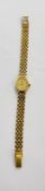 A 9CT GOLD GENEVE WRIST WATCH 014851 BOXED WITH ORIGINAL GUARANTEE.