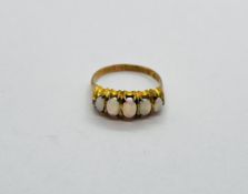 A VINTAGE 9CT GOLD 5 STONE OPAL RING.