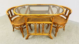 A BAMBOO FRAMED BISTRO TABLE AND MATCHING CHAIRS WITH GLASS INSET TOP.