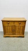A SOLID WAXED PINE TWO DRAWER TWO DOOR DRESSER BASE - W 100CM D 43CM H 86CM.