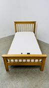 A LIGHT OAK SINGLE BED FRAME COMPLETE WITH UNO BRONZE DELUXE MATTRESS