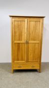 A SOLID LIGHT OAK DOUBLE WARDROBE WITH DRAWER TO BASE, W - 110CM, D - 60CM, H - 191CM.