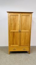 A SOLID LIGHT OAK DOUBLE WARDROBE WITH DRAWER TO BASE, W - 110CM, D - 60CM, H - 191CM.