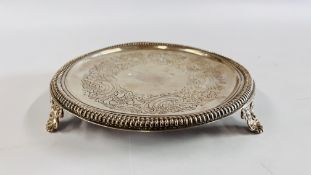 A SILVER CIRCULAR SALVER WITH NULLED RIM ON SCROLLED TRIPOD FEET BY JOESEPH WALKER OF DUBLIN C17