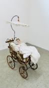 A VINTAGE WICKER DOLLS PRAM WITH METAL FRAME AND PARASOL COMPLETE WITH DOLL.