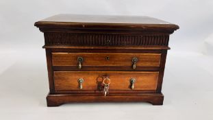 A VINTAGE MAHOGANY TWO DRAWER CANTEEN WITH FITTED INTERIOR THE CASE MARKED "FINNIGANS" ON FOUR