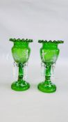 A PAIR OF GREEN GLASS LUSTRE VASES HAVING HAND PAINTED DETAIL IN THE MARY GREGORY STYLE - H 31CM.