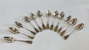 A GROUP OF 12 SILVER FIDDLE PATTERN DESSERT SPOONS, MAINLY LATE GEORGIAN EXAMPLES,