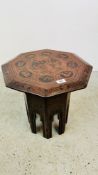 A LACQUERED OCTAGONAL OCCASIONAL TABLE WITH INDIAN DECORATION DEPICTING FIGURES, ELEPHANTS,