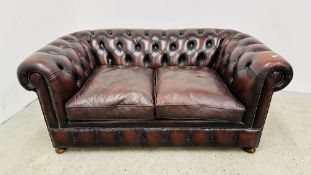 OXBLOOD LEATHER CHESTERFIELD STYLE TWO SEATER SOFA.