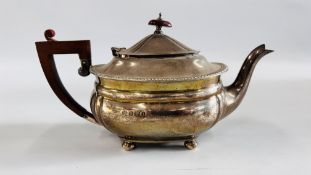 A SILVER TEAPOT,