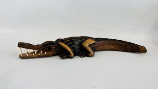 AN AFRICAN STYLE HARDWOOD TRIBAL CARVED CROCODILE, L 74CM.