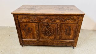 A SOLID OAK BLANKET BOX WITH HAND CARVED ENGLISH ROSE DETAIL - W 85CM D 44CM H 54CM.