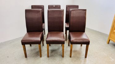 A SET OF 6 TAN FAUX LEATHER MODERN DINING CHAIRS.