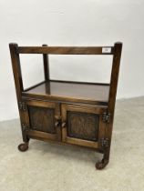 OAK 2 TIER TROLLEY WITH TWO DOOR CUPBOARD BASE WITH CARVED DETAIL.