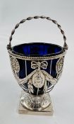 AN ANTIQUE SILVER SUGAR BASKET, THE PIERCED SIDES WITH GARLANDS AND BOWS,