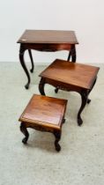 ORNATE GRADUATED SET OF HARDWOOD OCCASIONAL TABLES.