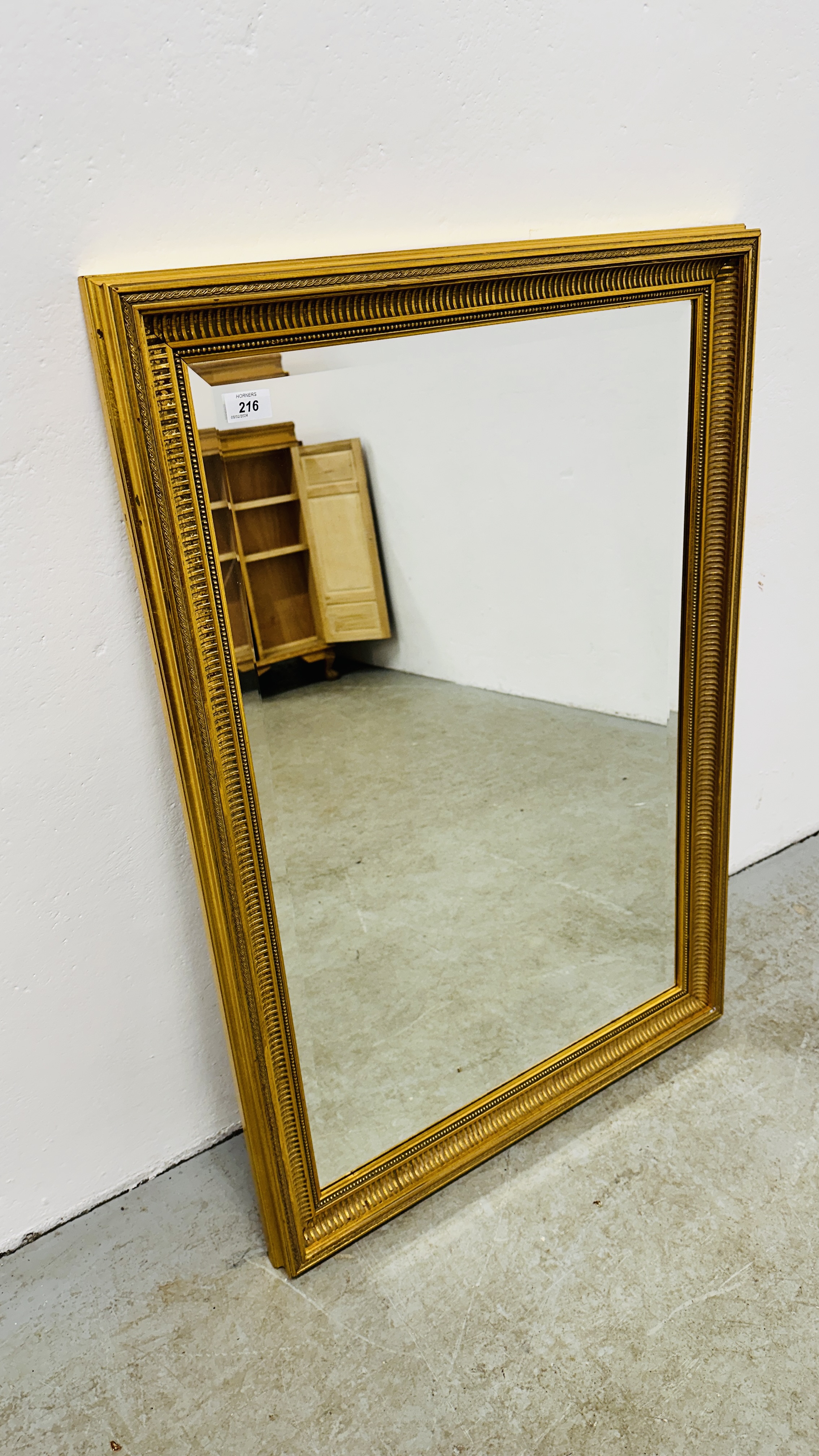 MODERN GILT FRAMED BEVEL PLATE MIRROR, 66CM X 99CM.