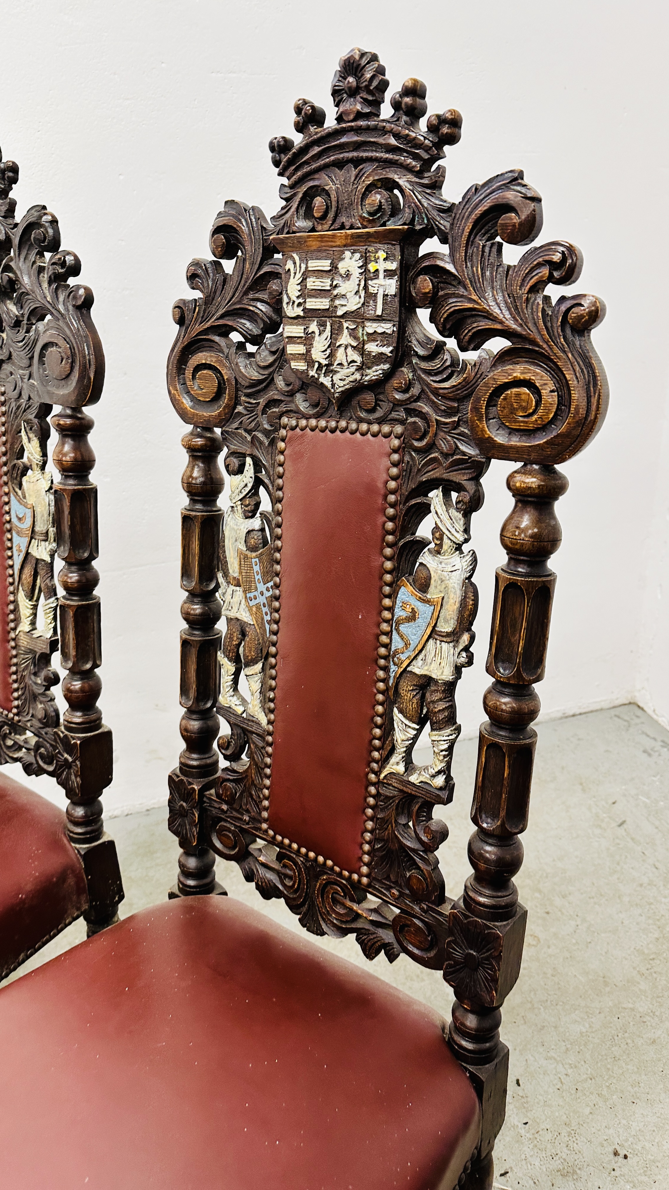 A SET OF 4 OAK FRAMED DINING CHAIRS WITH HEAVILY CARVED DETAIL BEARING CREST AND TWO KNIGHTS, - Image 12 of 12