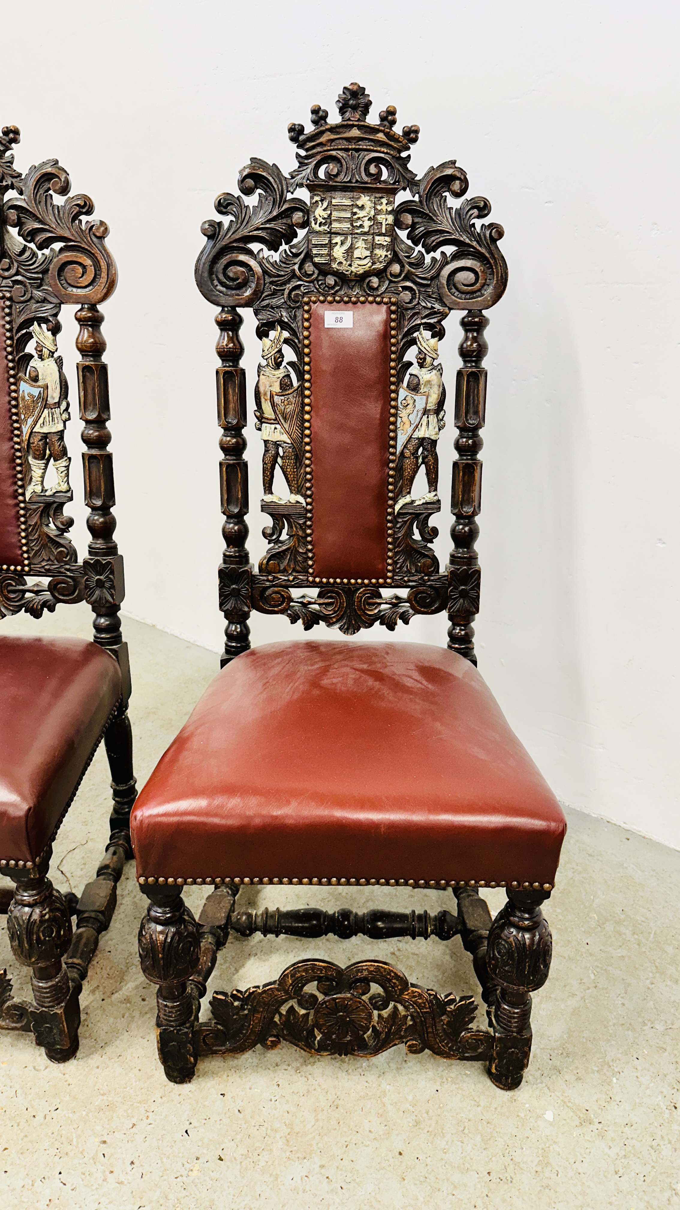 A SET OF 4 OAK FRAMED DINING CHAIRS WITH HEAVILY CARVED DETAIL BEARING CREST AND TWO KNIGHTS, - Image 7 of 12