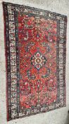 A RED/BLUE PATTERNED EASTERN RUG, 206 X 132CM.