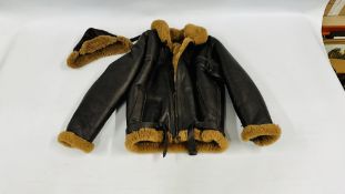 A VINTAGE SHEEPSKIN LEATHER FLYING JACKET ALONG WITH MATCHING HAT BEARING MAKERS LABEL CIRRUS.