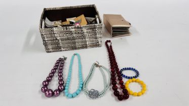 A BOX OF COSTUME JEWELLERY CONSISTING OF EARRINGS, NECKLACES AND BRACELETS.