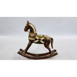 A VINTAGE STYLE WOODEN & BRASS FOLK ART ROCKING HORSE - H 45 X L 46CM.