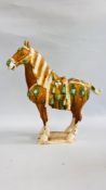 A LARGE TANG SANCAI STYLE BROWN GLAZED HORSE.