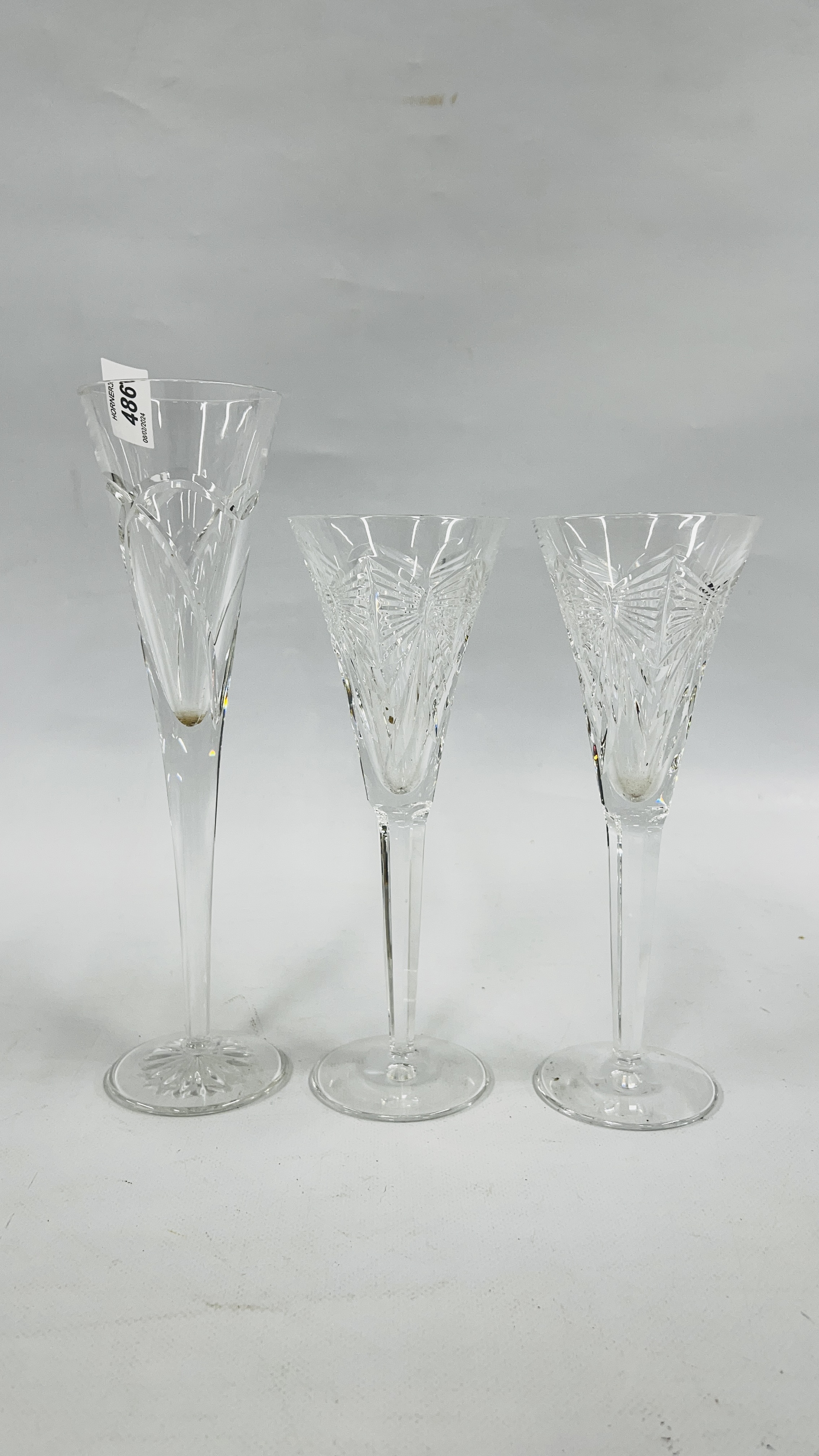 A PAIR OF WATERFORD MILLENIUM FLUTES ALONG WITH A FURTHER WATERFORD CRYSTAL FLUTE