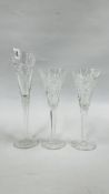 A PAIR OF WATERFORD MILLENIUM FLUTES ALONG WITH A FURTHER WATERFORD CRYSTAL FLUTE