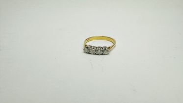 AN 18CT GOLD FOUR STONE DIAMOND RING SIZE M/N.