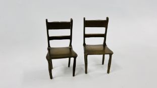 A PAIR OF VINTAGE SOLID BRASS DOLLS HOUSE CHAIRS - H 10CM.