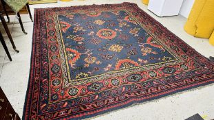 AN EASTERN DESIGN CARPET, THE BLUE GROUND DECORATED WITH MEDALLIONS, 294 X 253CM.