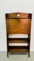 AN ARTS AND CRAFTS STYLE STUDENTS BOOKCASE / BUREAU WITH BRASS DETAILED HANDLE AND CARVED MOTIF A/F.