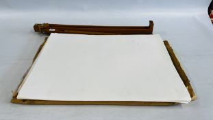 A FOLDING ARTISTS EASEL ALONG WITH A QUANTITY OF ART PAPER.