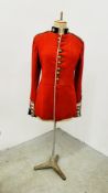 A VINTAGE OFFICER'S TUNIC MOUNTED ON A VINTAGE ADJUSTABLE DRESSMAKER'S DUMMY.