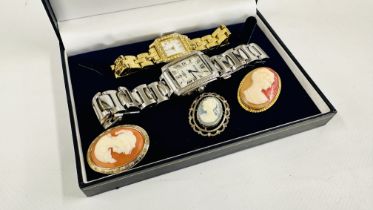 TWO DESIGNER WRIST WATCHES TO INCLUDE AN EXAMPLE MARKED AMADEUS AND 3 CAMEO BROOCHES.