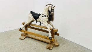 A WOODEN ROCKING HORSE IN DAPPLE GREY - HEIGHT 110CM, LENGTH 136CM.