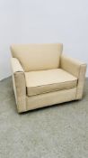 CREAM UPHOLSTERED ARM CHAIR / SOFA BED.