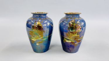 A PAIR OF CROWN DEVON LUSTRINE FIELDINGS VASES DEPICTING A GALLEON ON A BLUE GROUND - H 19.5CM.