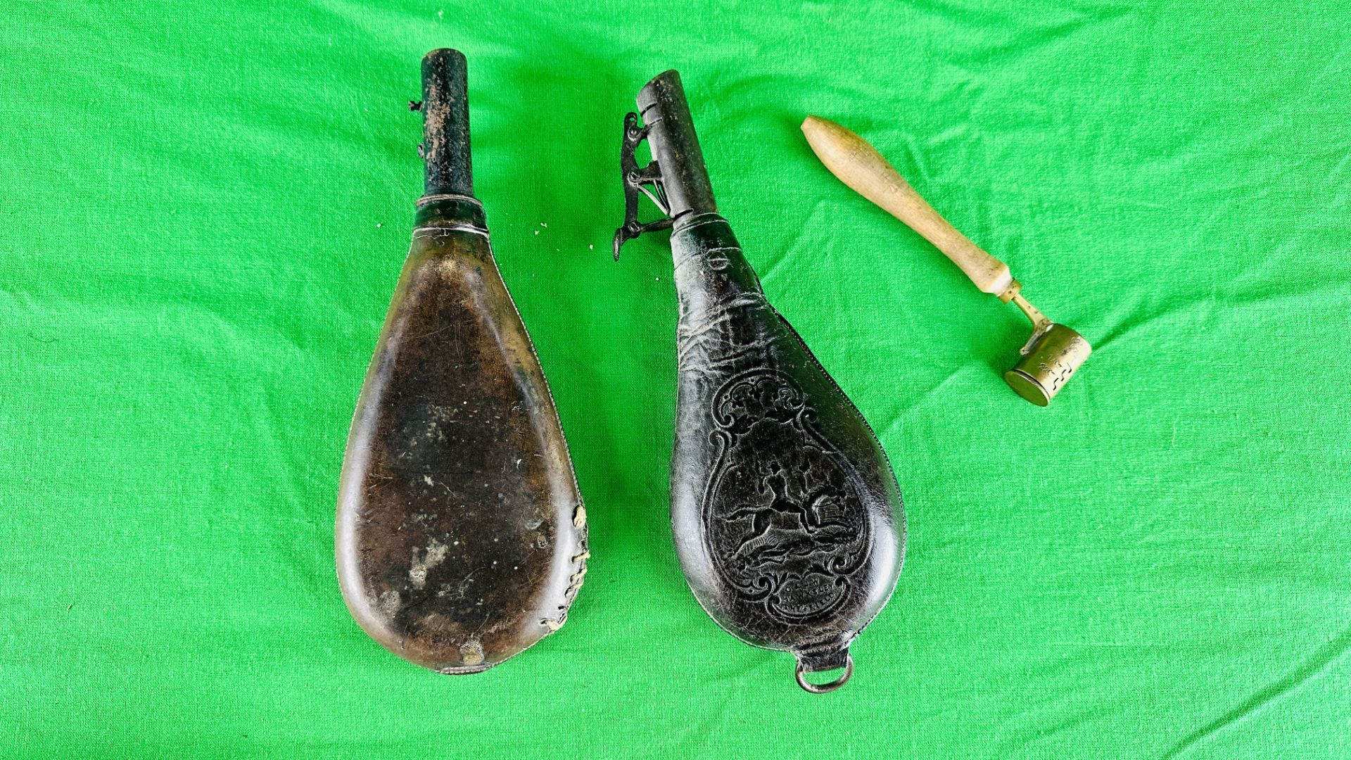 TWO ANTIQUE LEATHER POWDERED FLASKS - ONE MARKED C & J.