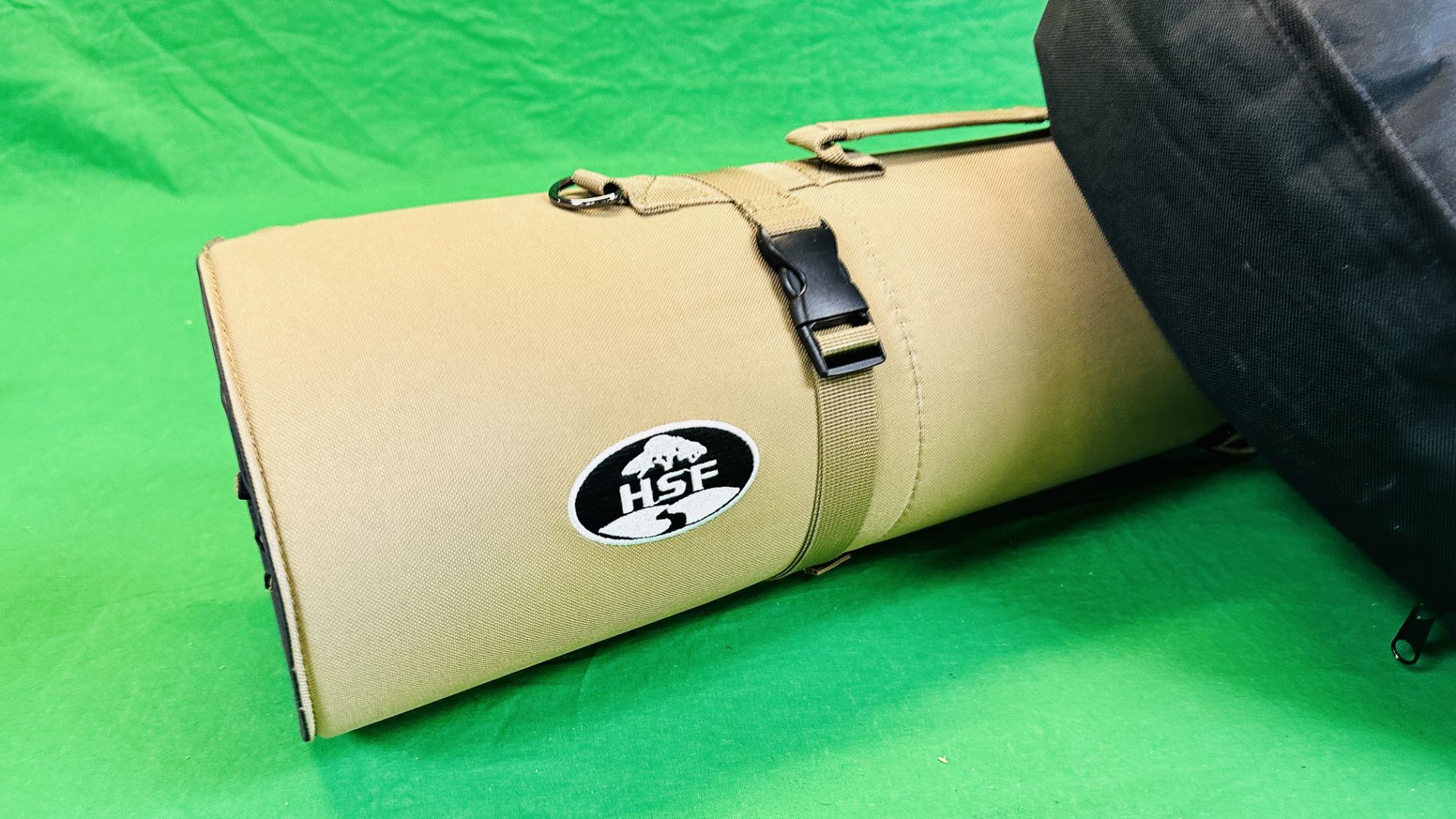 A BLACK CANVAS SHOOTING CUSHION ALONG WITH A GREEN ROLL OUT SHOOTING MAT. - Image 2 of 10