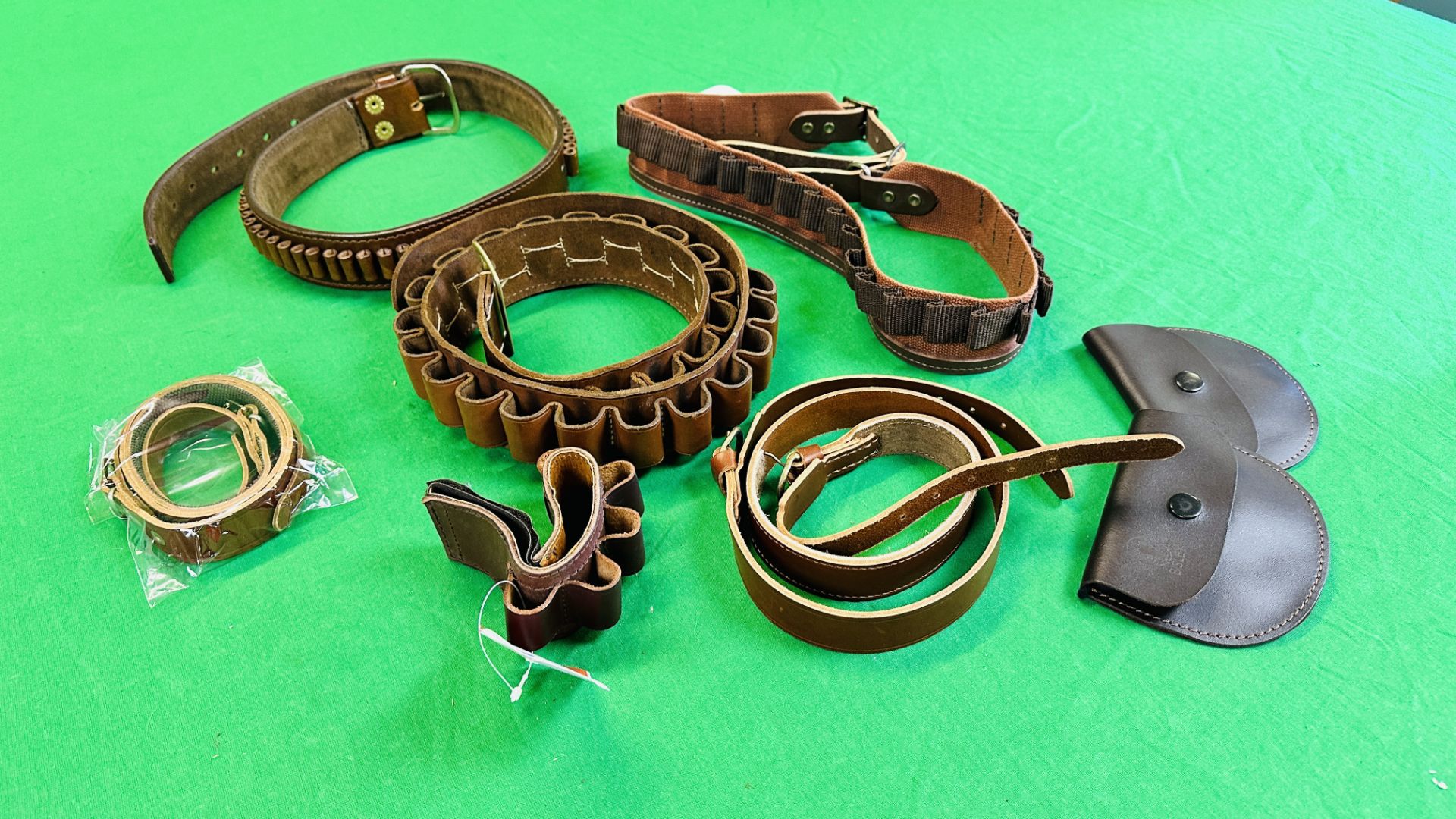 BOX CONTAINING GOOD QUALITY LEATHER CARTRIDGE BELTS / BULLET BELTS INCLUDING MARGETT, 12G,