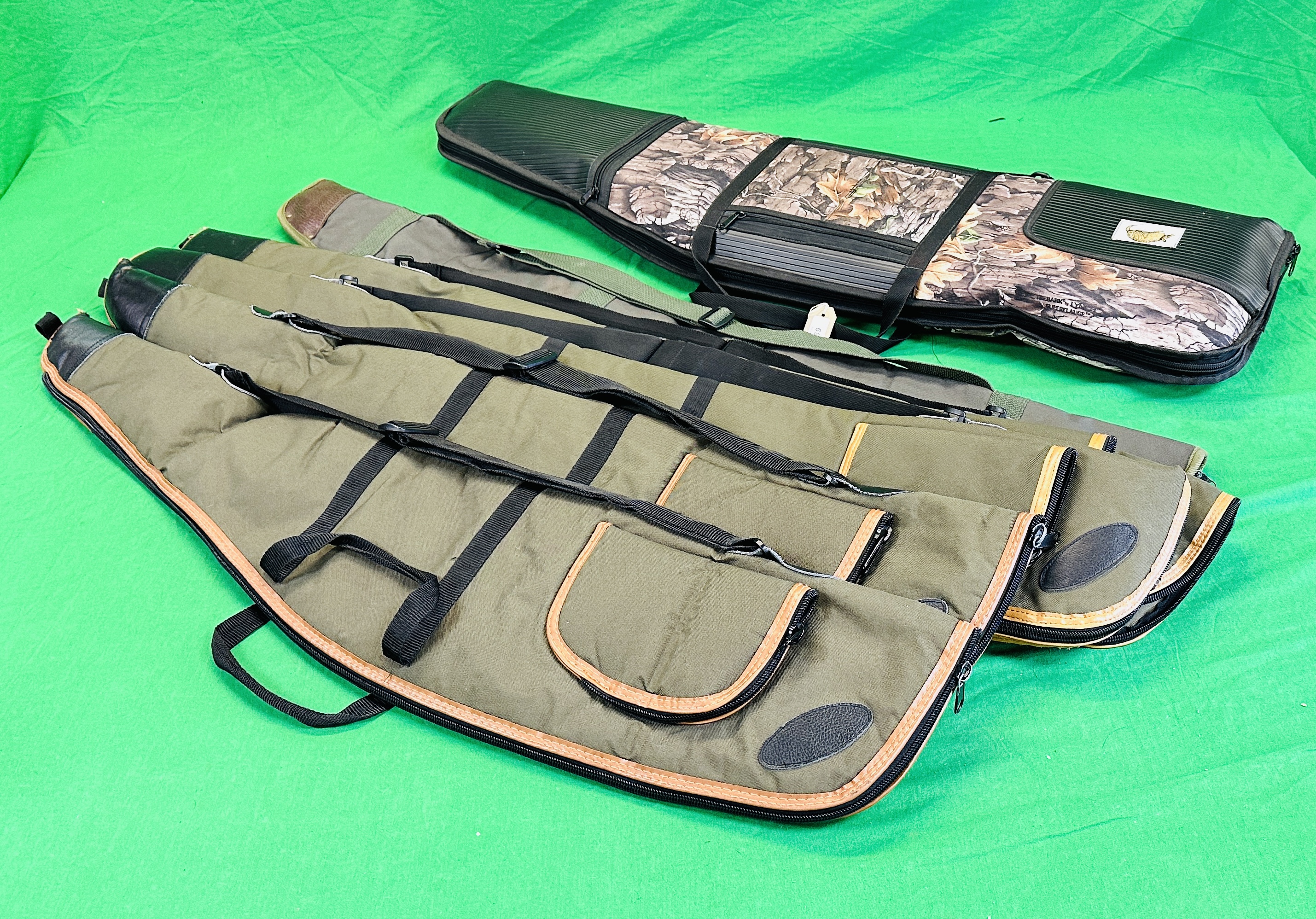 SIX CANVAS GUN SLIPS TO INCLUDE PADDED GUN GEAR PRODUCTS CAMO SLIP.